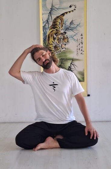 Man sitting and stretching his neck